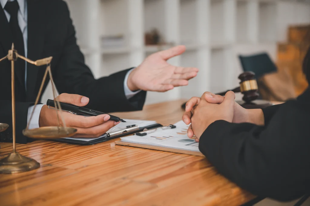 an image showing close-up hands of a defence attorney in Singapore, indicating the act of explaining matters to his client