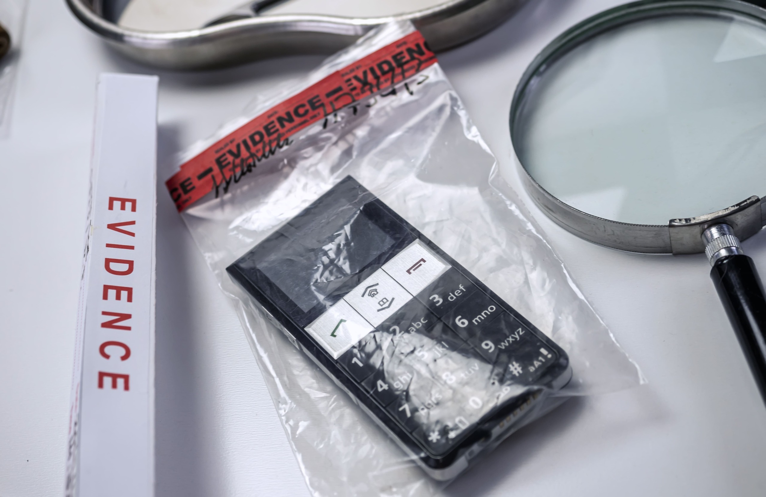 A mobile phone sealed in an evidence bag during a criminal investigation.