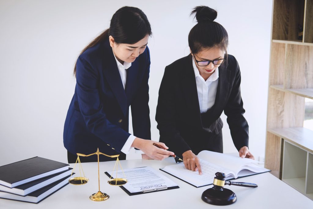 Lawyers review documents concerning a dispute over who possessed the property.